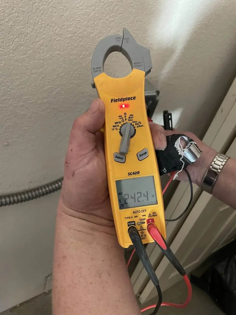 Voltage testing with clamp meter during Generator Installation in Greensboro